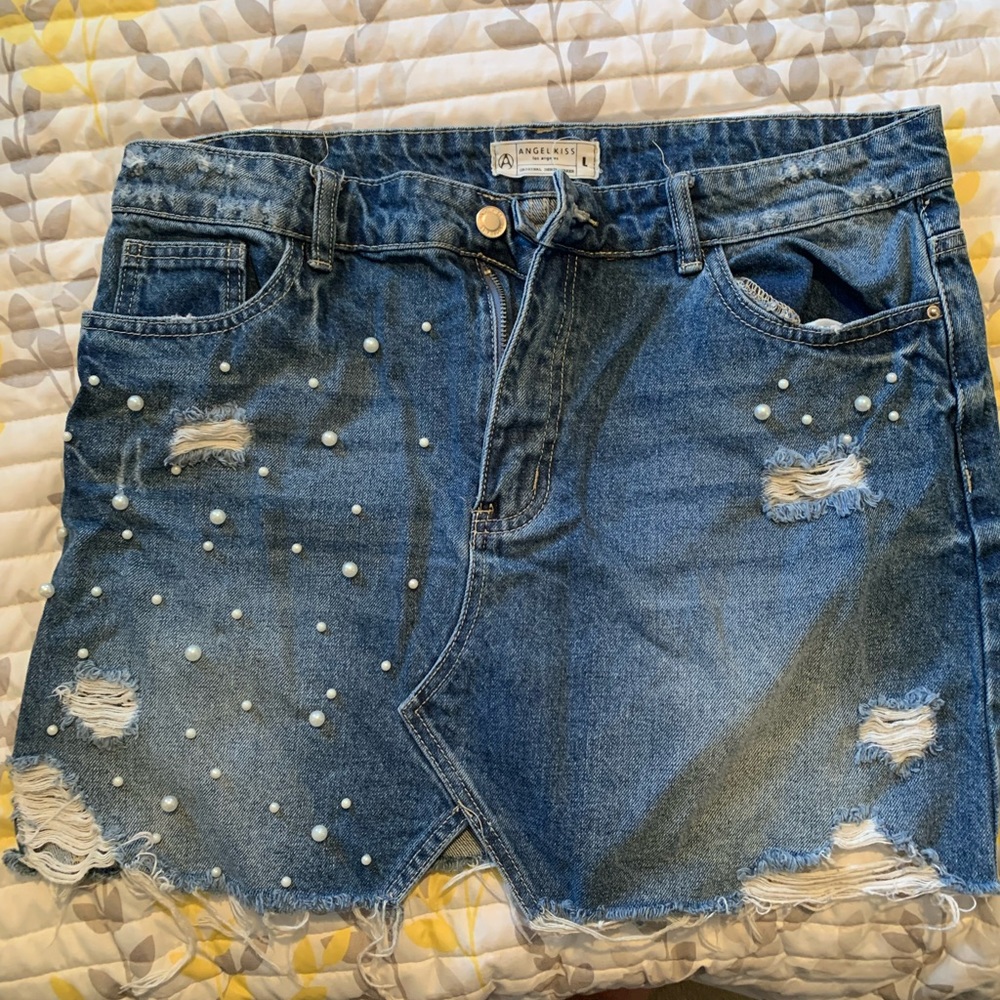 Angel Kiss women’s denim skirt, large. Pearl detail with ripped texture.